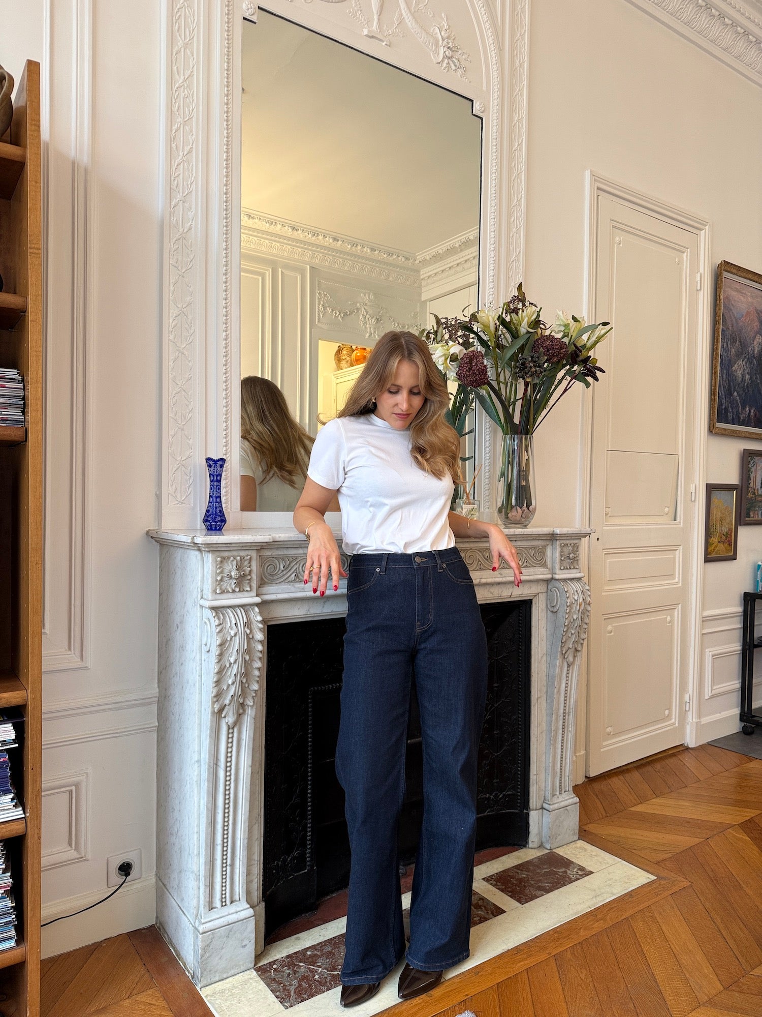 Classic everyday styling with a fitted white tee and relaxed dark denim.